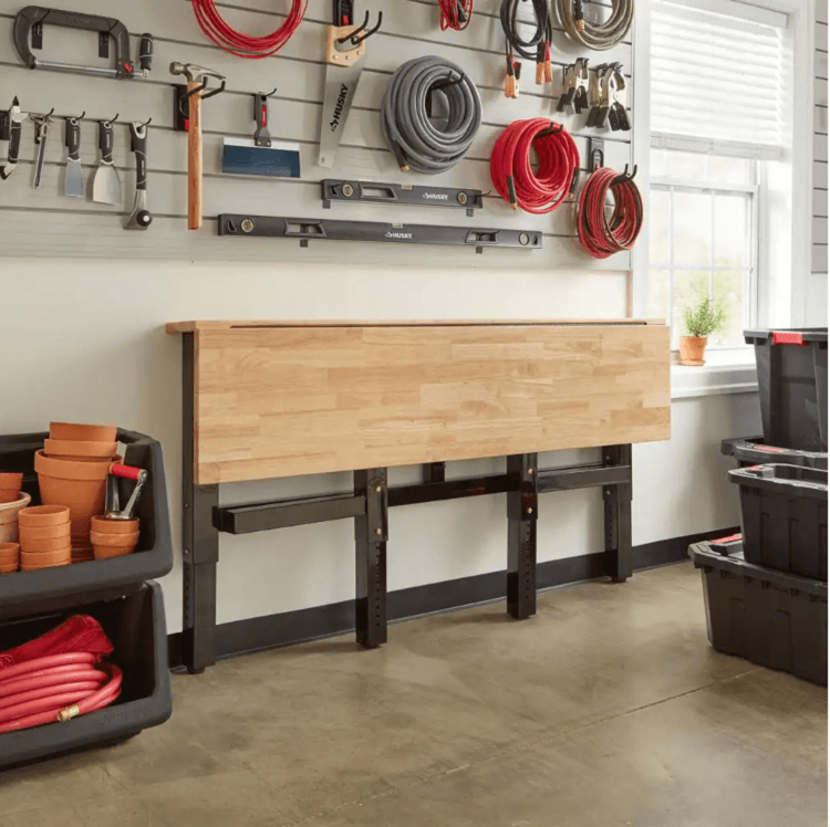 Husky Folding Wood Top Workbench Saves Space with Adjustable Height Feature